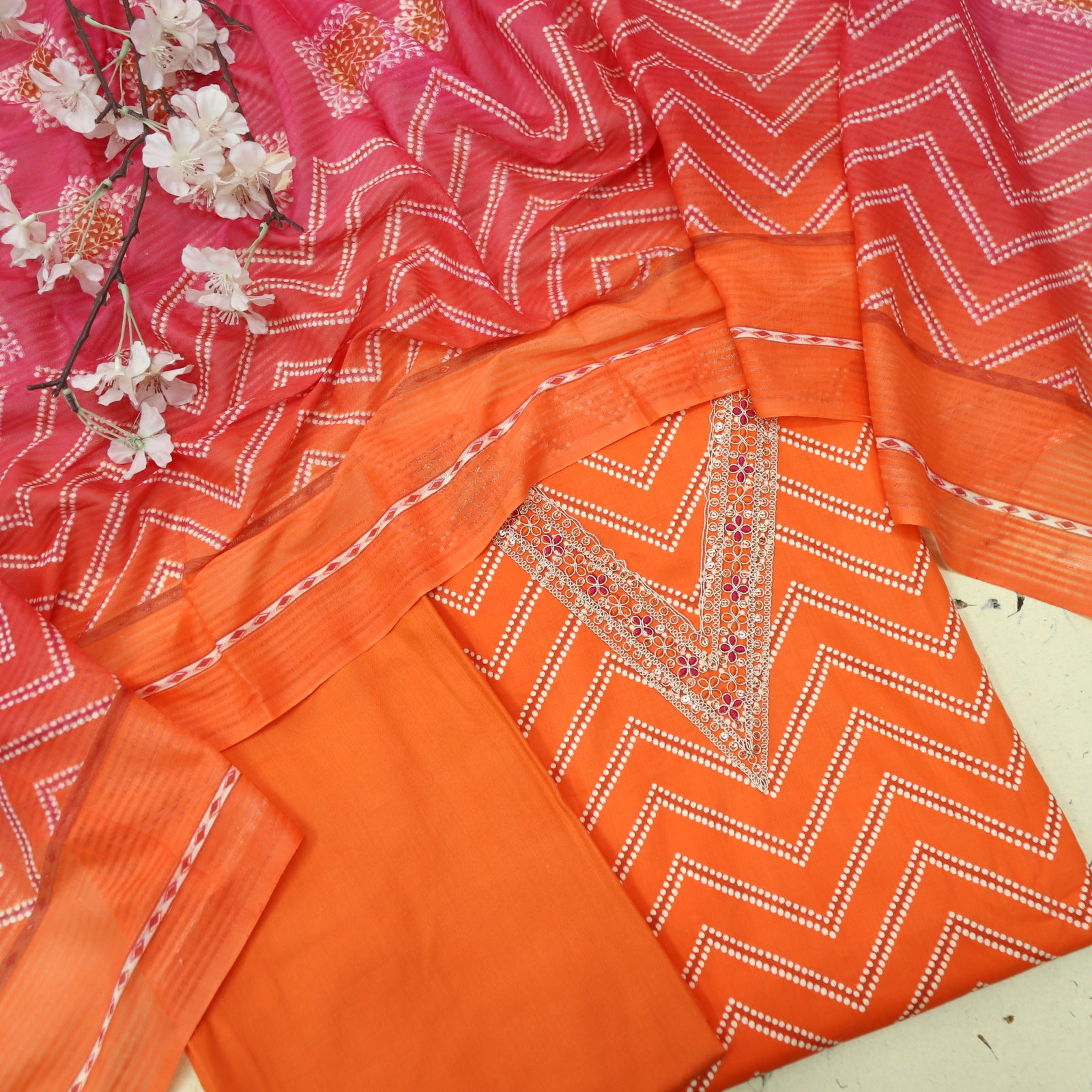 Adaa Bright Orange V Embellish Neck Leheriya Print Cotton Suit Set