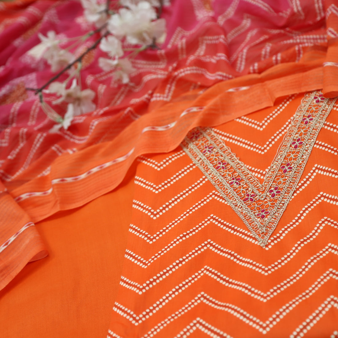 Adaa Bright Orange V Embellish Neck Leheriya Print Cotton Suit Set